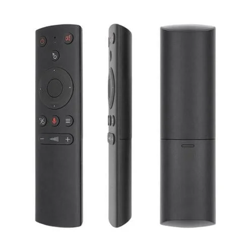 A black remote control with various buttons, including a directional pad and a microphone, displayed from three angles against a light background.